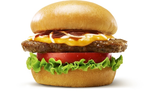 モスバーガーの新とびきりバーガーが袋からはみ出すほどのボリューム感を伝える画像