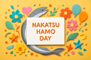 中津ハモの日を祝うカラフルなペーパーアート、ハモの魚と記念日メッセージが描かれたデザイン