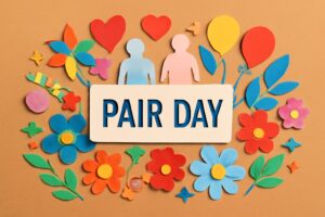 ペア活の日（11月2日）を祝う、カラフルな紙のアートと「PAIR DAY」の文字が描かれたデザイン。大切な人と過ごす素敵な時間を表現。